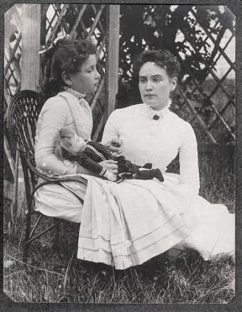 Hellen Keller holding doll with Anne Sullivan 1888